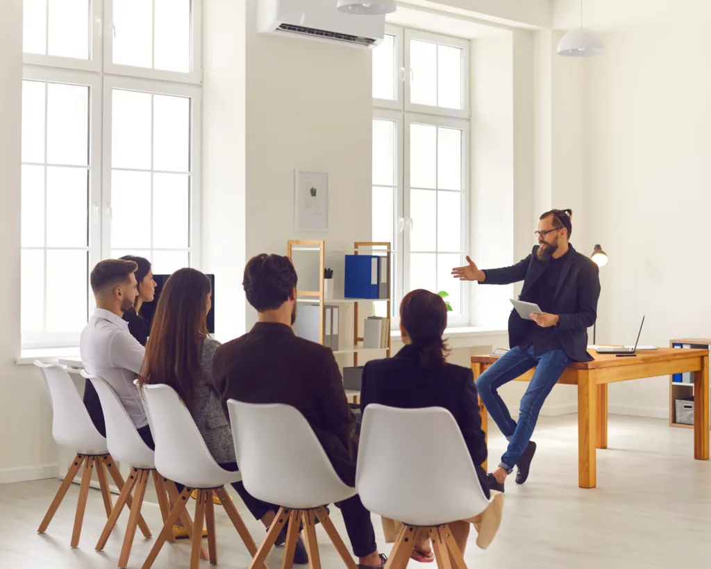 Professional presenting to a business team during a coaching session